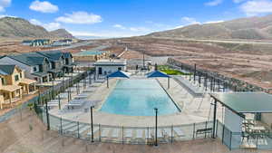 View of swimming pool with a mountain view and a patio area