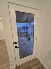 Doorway featuring hardwood / wood-style flooring