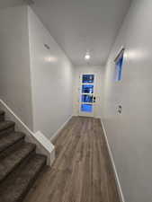 Hallway with wood-type flooring