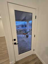 Doorway featuring hardwood / wood-style floors