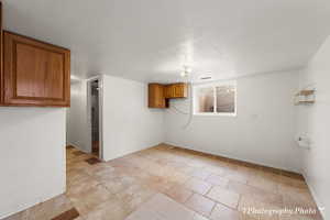 Empty room featuring a textured ceiling