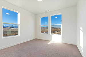 Empty room with carpet floors