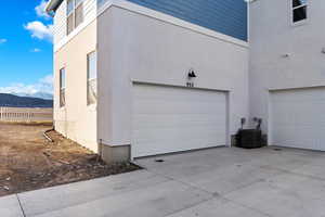 Garage with central AC unit and a mountain view