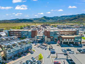 Birds eye view of property with a mountain view