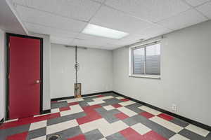 Basement featuring a drop ceiling