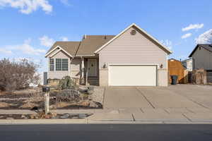 Ranch-style house featuring a garage