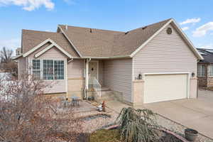 View of front facade featuring a garage