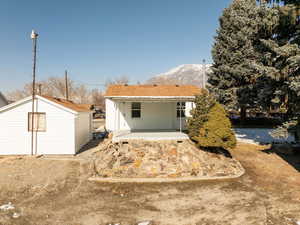 Back of house featuring a mountain view