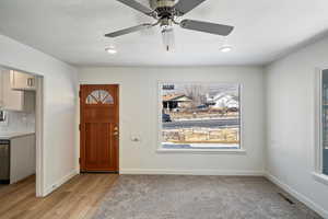 Foyer entrance featuring light hardwood / wood-style floors