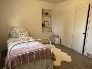 Bedroom featuring carpet flooring