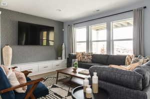 Living room featuring light hardwood / wood-style floors. *Photos are of our Stella model home.  Actual colors and finishes will vary.  See agent for additional information.