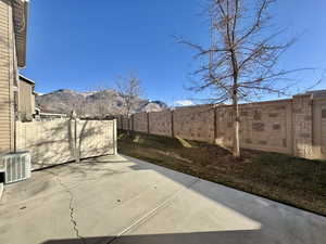 View of patio / terrace featuring a mountain view and central AC