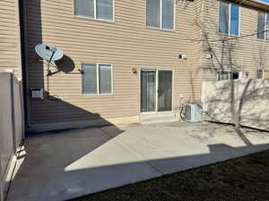 Rear view of property featuring a patio and cooling unit