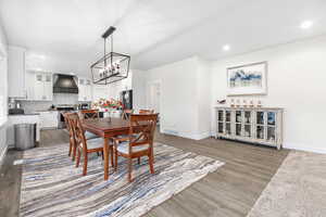 Dining space with sink and dark hardwood / wood-style floors