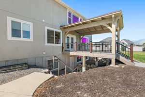 Exterior space featuring a mountain view,  french doors and walk out basement