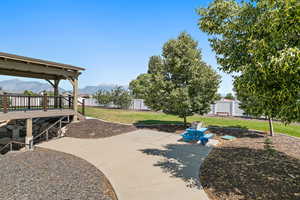 View of patio / terrace featuring a deck with mountain view