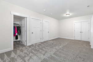 Unfurnished bedroom with carpet