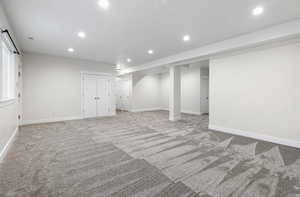 Basement with carpet flooring