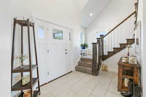 Foyer with high vaulted ceiling