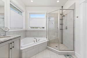 Primary Bathroom with independent shower and bath and vanity