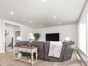 Living room with hardwood / wood-style flooring