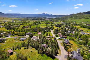 Birds eye view of property with a mountain view