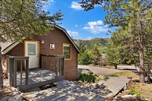 Exterior space featuring a deck with mountain view