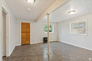 Interior space featuring a textured ceiling