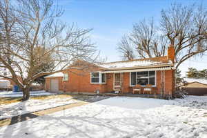 View of front of property featuring a garage