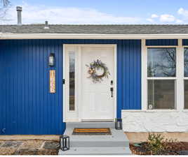 Property entrance with roof with shingles