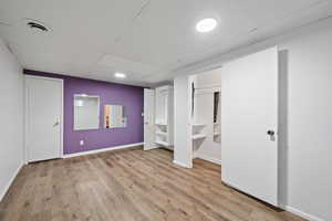 Basement bedroom with walk in closet.