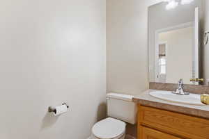 Bathroom featuring vanity and toilet