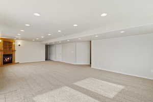 Basement with light colored carpet