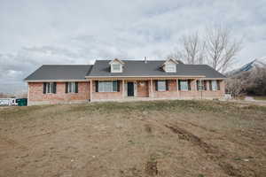 View of front of property with a front yard