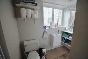 Bathroom with tile patterned flooring and toilet