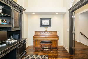 Misc room with dark wood-type flooring