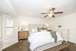 Bedroom featuring dark wood-type flooring and ceiling fan