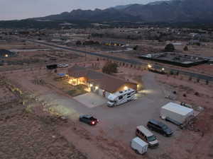 Aerial view at dusk featuring a mountain view