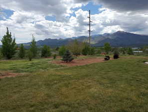 Property view of mountains with a rural view