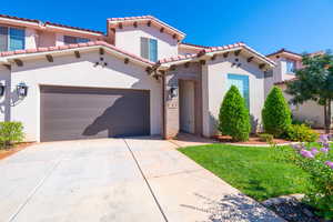 Mediterranean / spanish home featuring a garage