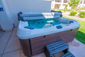 View of patio / terrace with a hot tub