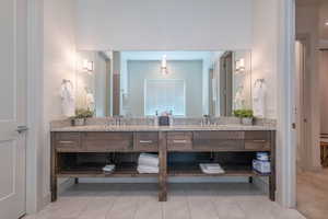 Bathroom featuring vanity and tile patterned flooring