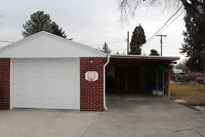 Garage featuring a carport