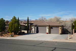 View of front of house featuring a garage and a mountain view