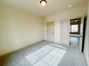 Unfurnished bedroom featuring light carpet