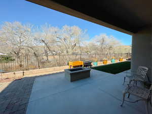 View of patio / terrace with a fire pit