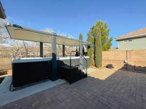 View of patio / terrace with a hot tub