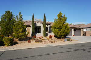 View of front of property featuring a garage