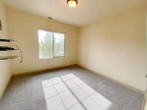 Empty room featuring carpet floors