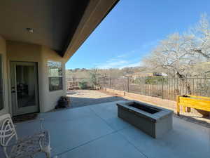 View of patio / terrace with an outdoor fire pit